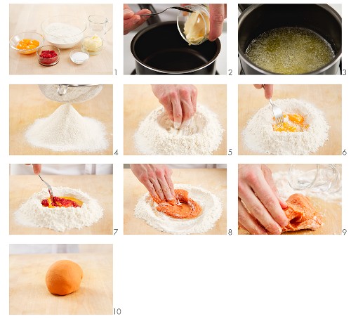 11047878         - Pasta dough being coloured with tomato puree