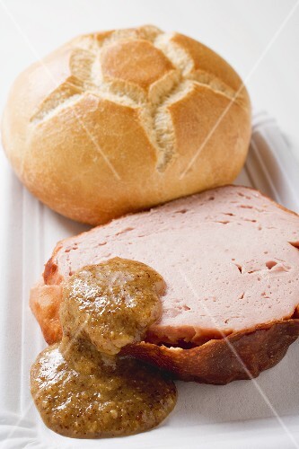 Roll, Leberkäse (type of meatloaf) & sweet mustard on paper plate