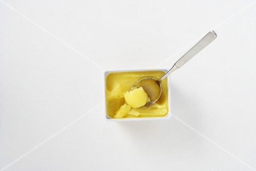 Clarified butter in a bowl with a spoon