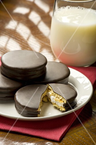 Moon Pies on a Plate; One Broken in Half; Glass of Milk
