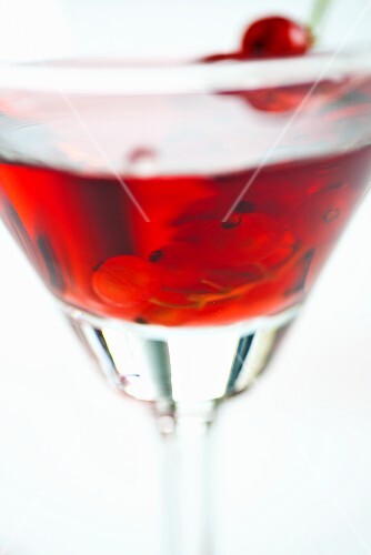 A glass of redcurrant liqueur (close-up)