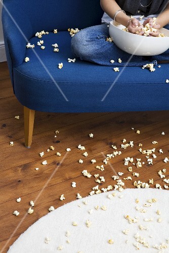 Woman with popcorn mess