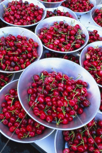 Cherries in metal bowls