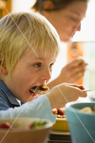 Woman and small boy at breakfast