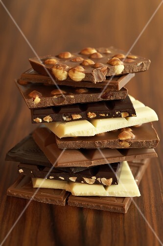 An assortment of chocolate bars in a pile