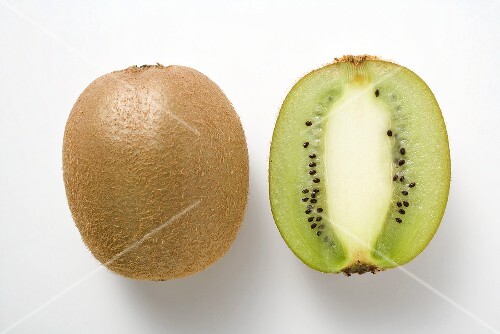Whole kiwi fruit & half a kiwi fruit (longitudinal section)