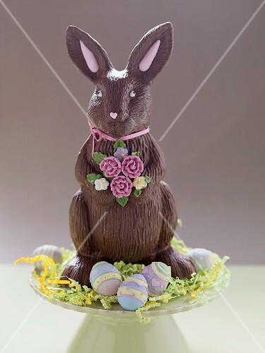 Chocolate Easter Bunny surrounded by Easter eggs