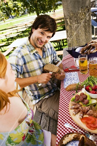 Young people having snack in beer garden