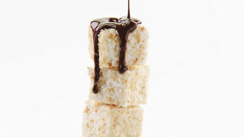 Coating coconut cubes with couverture chocolate