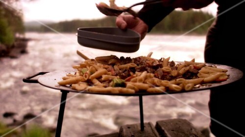 Serving dish cooked on open fire by river
