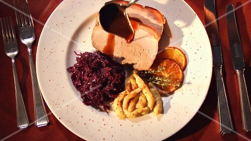 Roast pork with red cabbage, spaetzle noodles and sauce
