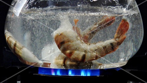 Prawns falling into boiling water