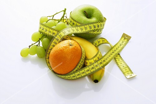 Assorted fruit with a tape measure