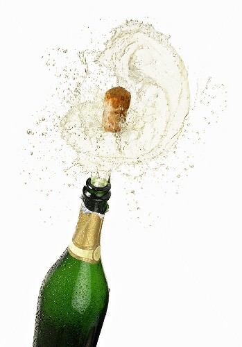 Cork flying out of a sparkling wine bottle