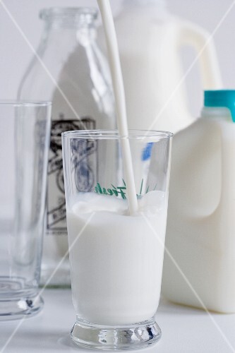 Milk%20Pouring%20into%20a%20Gl***;%20Milk%20Jugs,%20Bottle%20and%20Empty%20Gl***