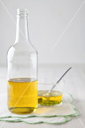 Vinegar in a bottle and in a glass bowl