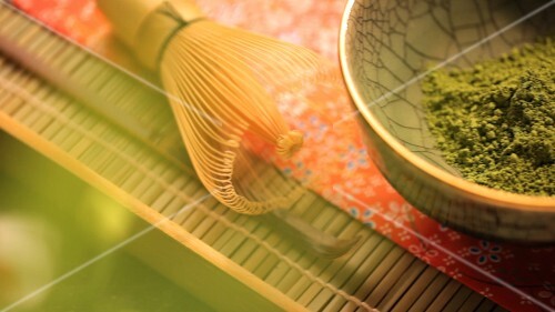 Japanese matcha tea powder and a matcha brush