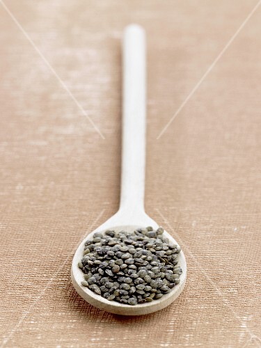 Green lentils on a spoon