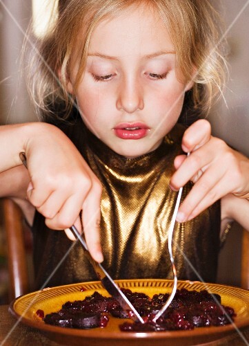 A girl eating beetroot