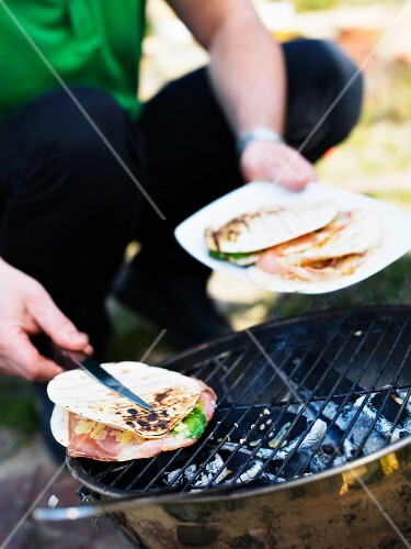 A man grilling unleavened bread