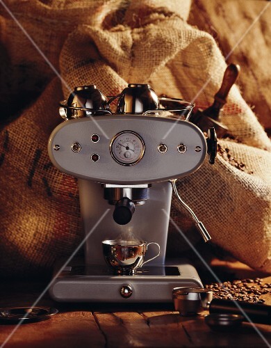 Espresso machine in front of jute sacks
