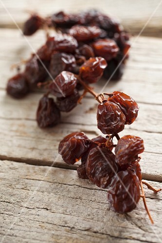 Raisins on a wooden surface