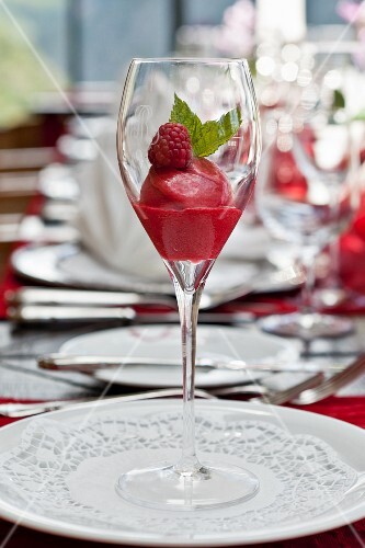 Raspberry sorbet and fresh mint in a champagne glass