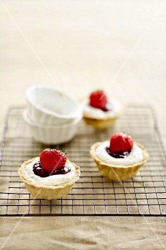 Strawberry tartlets on cooling rack