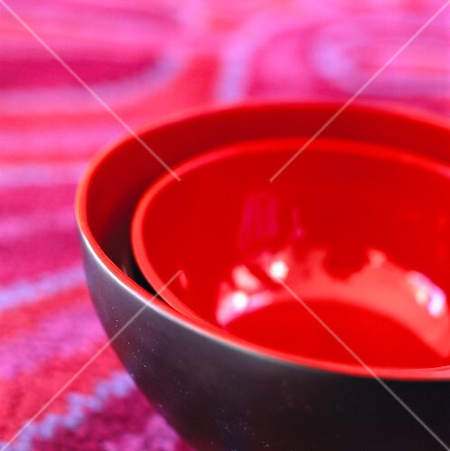 A set of black and red bowls