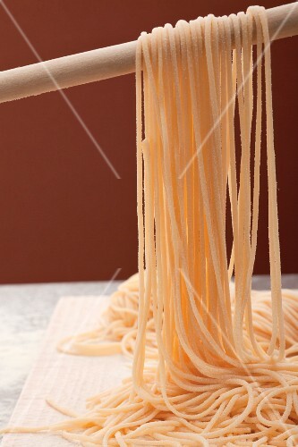 Home-made spaghetti hung up to dry