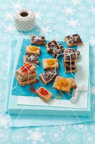 Poppy seed biscuits topped with chocolate and spices (garam masala, curry)