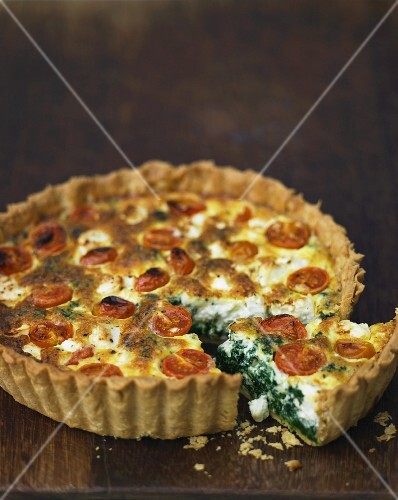 Tomato quiche with spinach, sliced