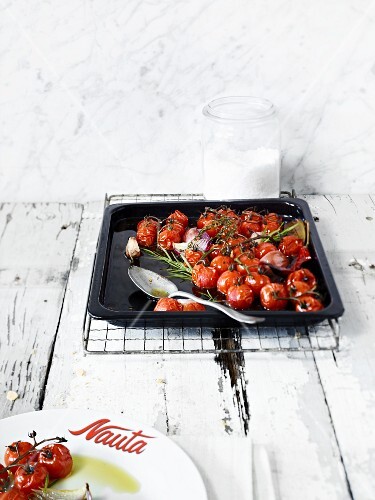 Braised cherry tomatoes on a baking tray