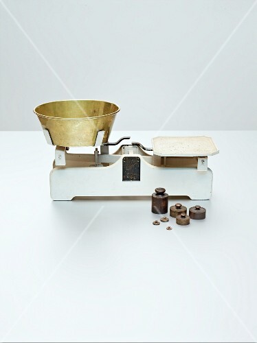 An old-fashioned pair of scales with weights