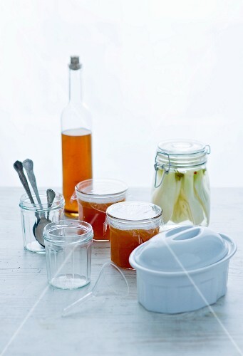 Marmelad, preserved vegetables, a bottle of vinegar and terrine