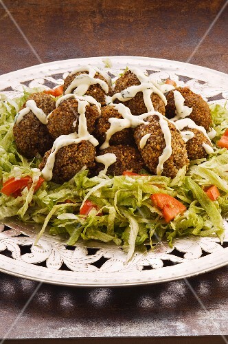 Kibbeh (grain-meat-meatballs on a salad plate)
