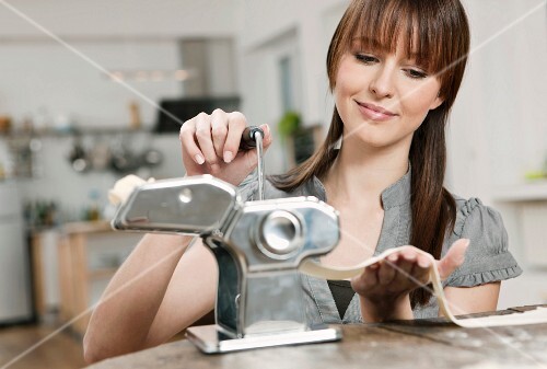 A woman making pasta