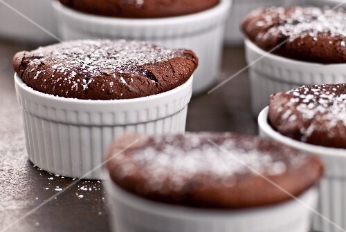 Individual Cakes Baked In Ramekins Dusted with Powdered Sugar