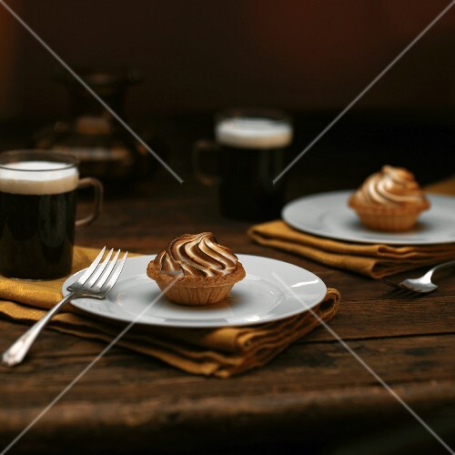 Chocolate Caramel Tartlets with Toasted Meringue; On White Plates; Coffee