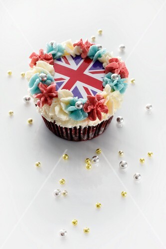 A cupcake topped with butter cream and a Union Jack
