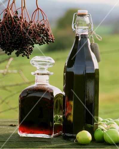 Elderberry liqueur and juice in bottles