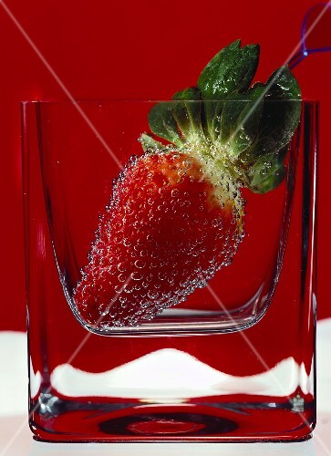 Strawberry in a glass of water