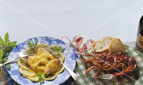 Fish with lemon sauce and baked lobster with white bread