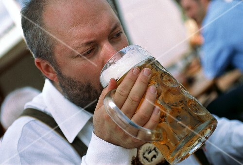 Man drinking a litre of beer at Oktoberfest