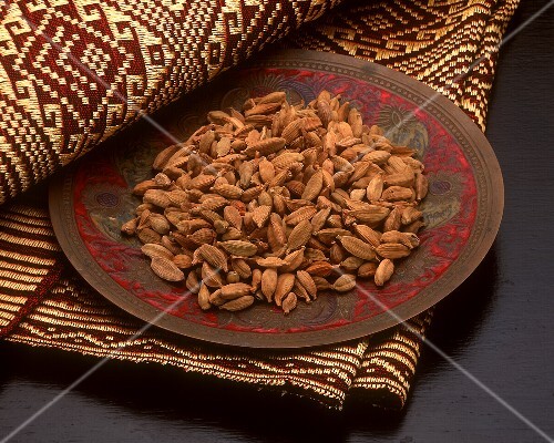 Cardamom pods on a plate
