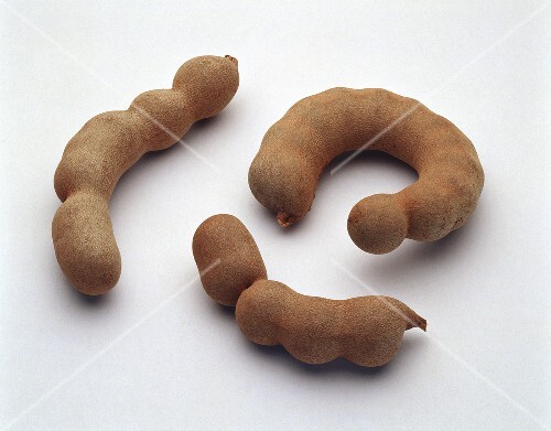 Three tamarinds on a light background