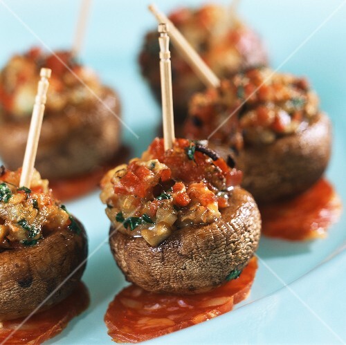 Stuffed mushrooms with chorizo on cocktail sticks
