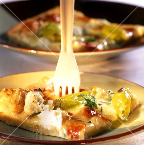 Pizza quattro formaggi with cheese and chili peppers
