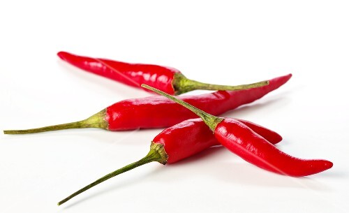 Four red chili peppers