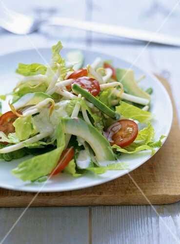 Romaine lettuce with avocado and sprouts